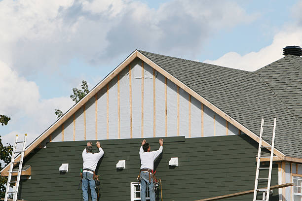 Professional Siding Installation technician working in Rolesville, NC